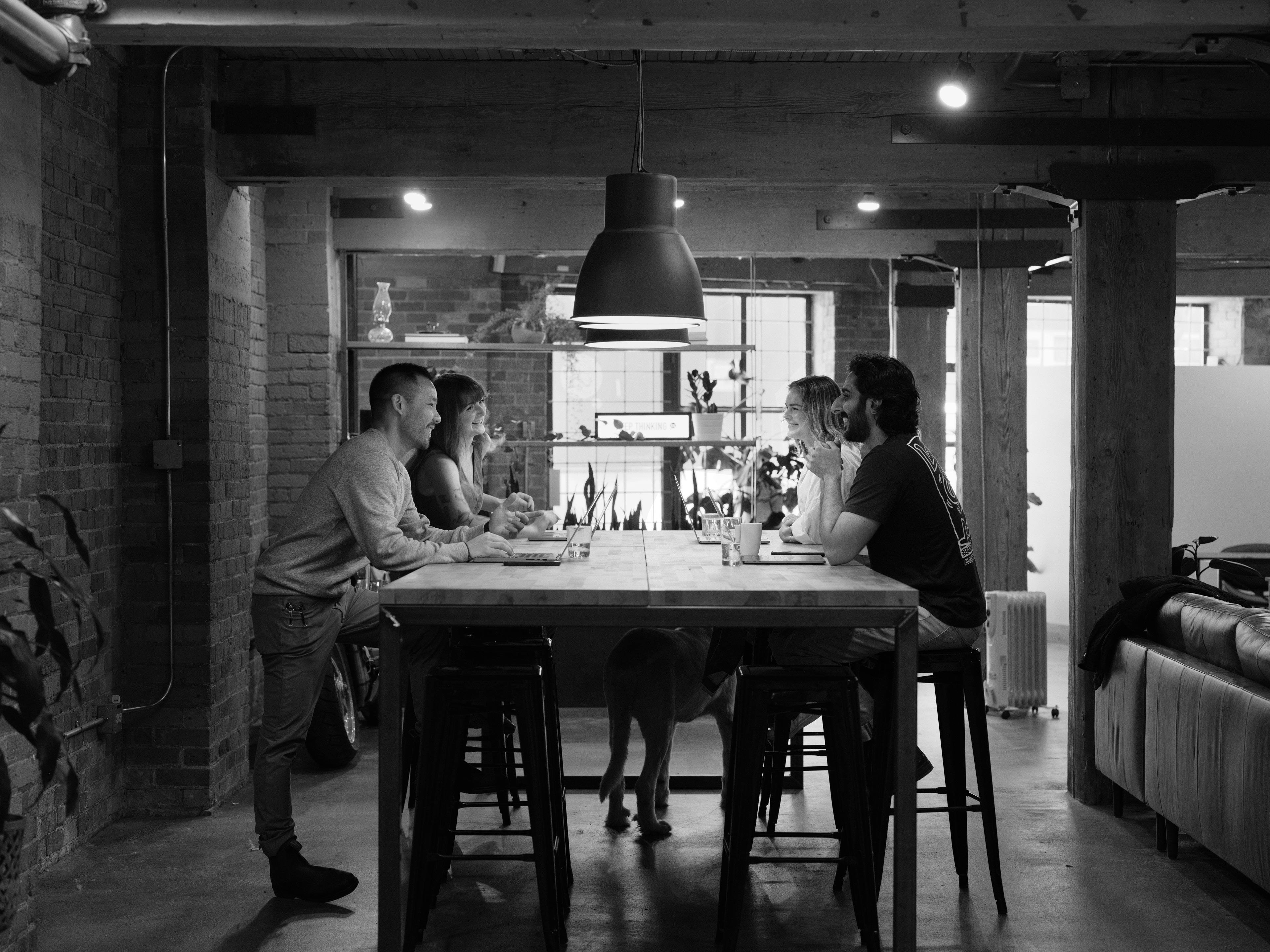 Some of the Thought Shop team at a big table